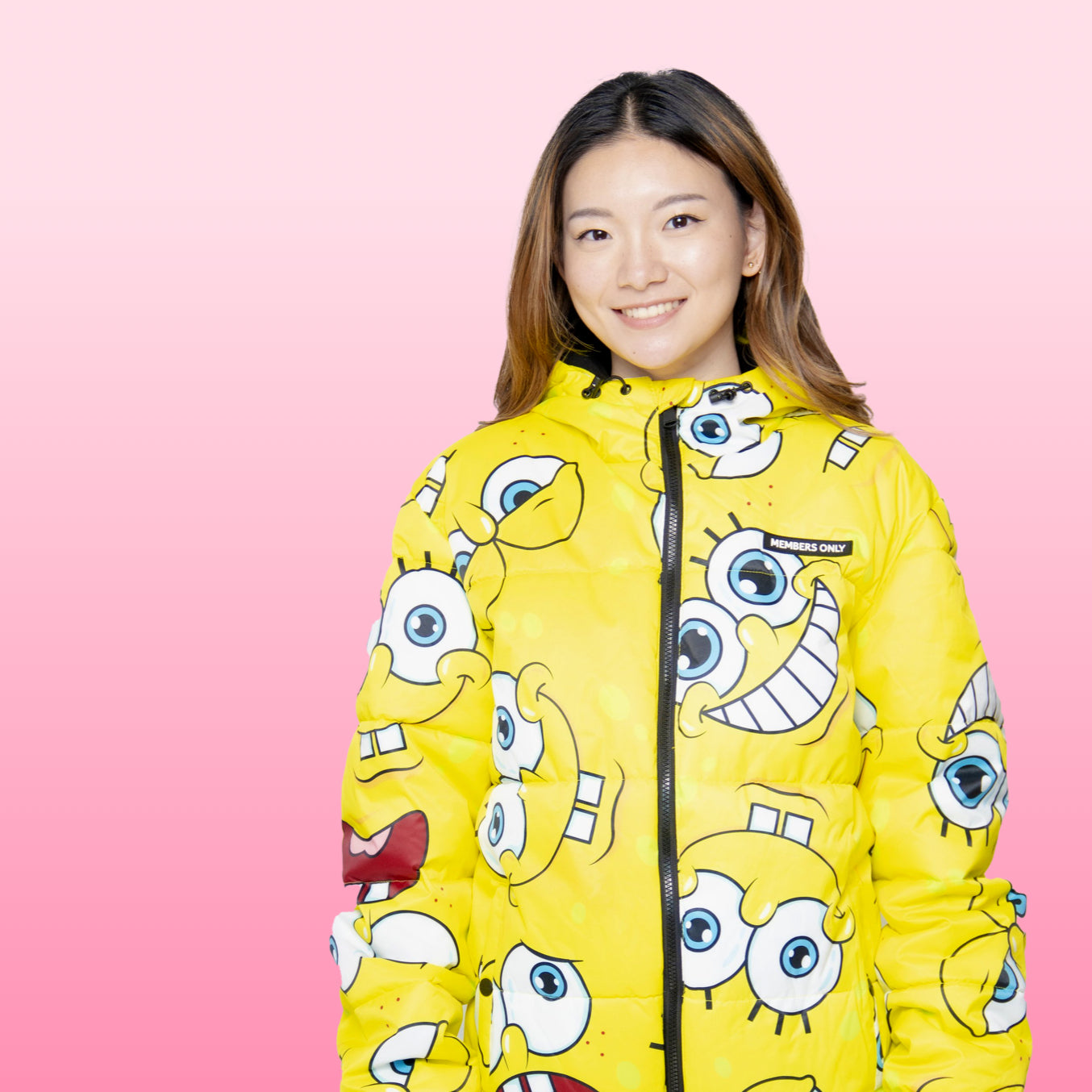 Girl in spongebob squarepants yellow puffer jacket